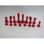 A Victorian ivory part chess set in mahogany case, (White Knight and Pawn replaced)