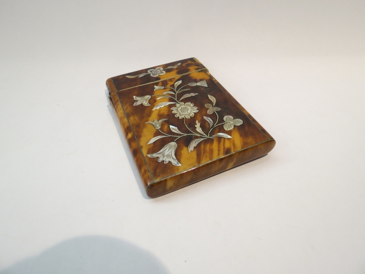 A tortoiseshell card case with mother-of-pearl inlay, foliate and thistle design, 10.