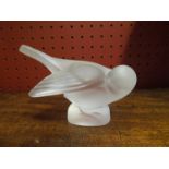 A Lalique figure of a preening sparrow, etched "Lalique, France" to base,