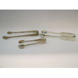 Three pairs of silver sugar tongs including Newcastle and Georgian,