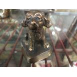 An early 20th Century bronze model of a smiling puppy