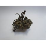 A bronze spice pot with mounted peacock and birds surrounding,