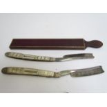 A pair of Joseph Rodgers & Sons mother-of-pearl handled cut throat razors together with a file