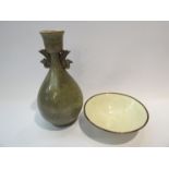 A Chinese Yaozhou ware peacock handled vase and a Ding ware copper gilt bowl,