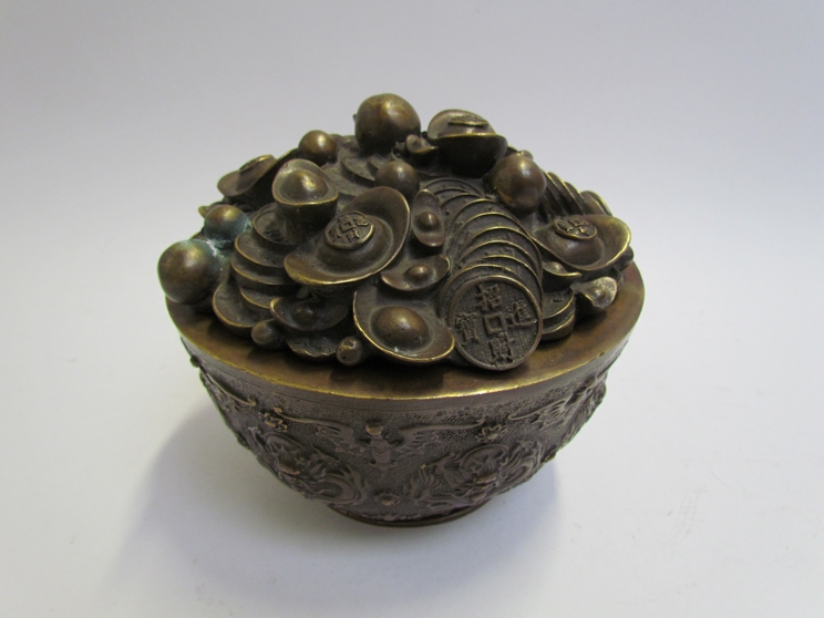 An early 20th Century bronze lidded bowl with dragon medallion decorated body.