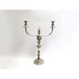 A late 19th Century Sheffield plate candelabra with three sconces; two on extended reeded arms,