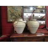 A pair of cream and gilt pottery table lamps with shades