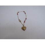 A 9ct gold coral heart bracelet, 1.