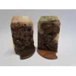 Signed A H Hamer 1947 a pair of marble and carved oak bookends,