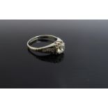 An 18ct white gold platinum set diamond ring the central diamond 1ct approximately with diamond set