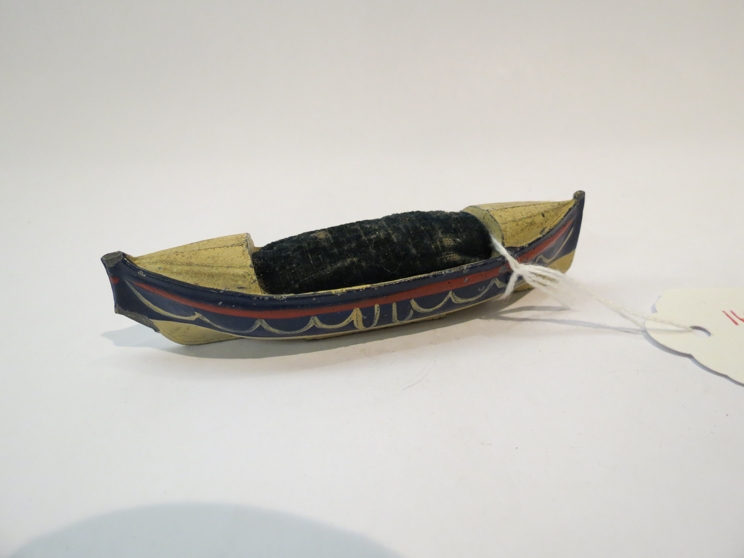 An early 20th Century Royal National Lifeboat diecast pin cushion