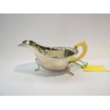 An Emile Viner silver sauce boat with ivory handle Sheffield 1939,