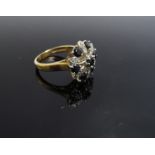 A 9ct gold diamond and sapphire cluster, size N, 4.