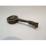 An early 20th Century tortoiseshell and abalone shell inlaid miniature banjo