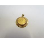 An 1893 gold sovereign with 9ct gold circular mount (coin loose)