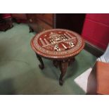 An Indian inlaid ebony and bone circular top lamp table with carved elephant legs