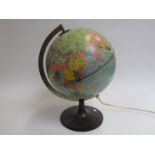 A Danish design illuminated world globe on Bakelite stand