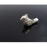 A silver whistle of bird form possibly a wren,