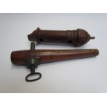 A 19th Century treen barrel tap and a carved treen wood pigeon whistle