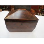 A mahogany tea caddy with lion mask handles