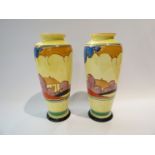 A pair of Clarice Cliff Bizarre Cafe-au-Lait Autumn vases, each of slender baluster form,