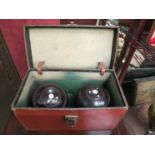 A pair of "Irvine and Sellers, Preston" lignum vitae bowls balls inset with mother of pearl,