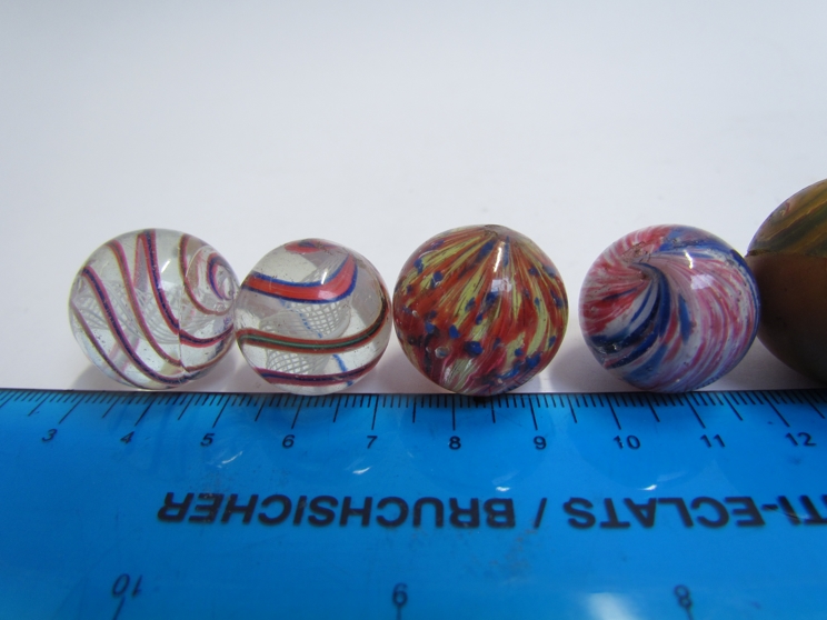 An assortment of vintage marbles including Victorian onion skin and spiral twist