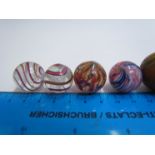 An assortment of vintage marbles including Victorian onion skin and spiral twist