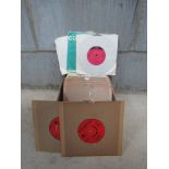 A box of mixed 7" singles