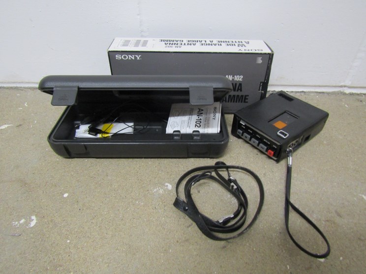 A boxed Sony TC-55 dictaphone and a Sony wide range antenna case and some contents