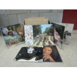 A box of assorted LPs including John Lennon, Led Zeppelin, Bob Marley etc.