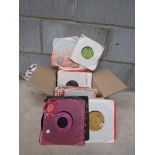 A collection of 7'' singles including T Rex, Sex Pistols, The Beatles, Roxy Music etc.