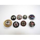 A collection of German party and lapel badges.