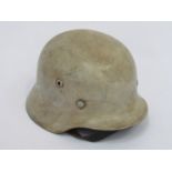 A German M40 style helmet with later tropical painted shell bearing single Luftwaffe decal,