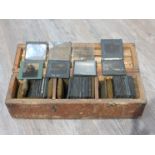A case of WWI glass magic lantern plates including Zepplins,