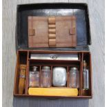 A brown leather campaign style writing case with contents