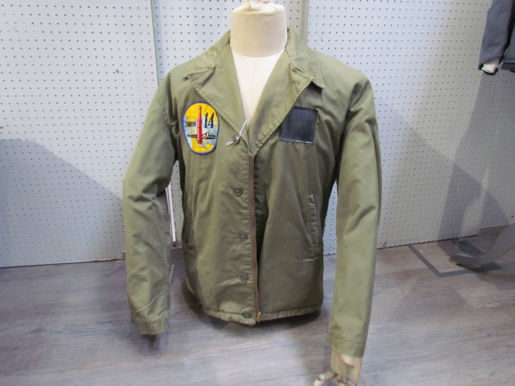 A WWII or after US Navy field jacket with Subron 14 Scottish submarine base badge