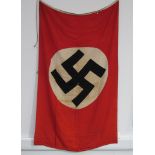 A Third Reich era German Nazi party flag, the central black swastika upon a white circle,