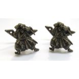 Two cast metal Japanese samurai form handles