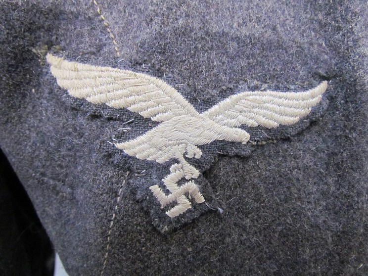 A Third Reich era German Luftwaffe Battledress blouse with Private rank (Flying) insignia to collar, - Image 2 of 4