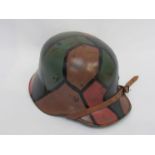 A WWI German 1917 pattern camouflage helmet in restored condition
