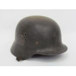 A Third Reich era German M40 helmet with single Luftwaffe decal (swastika worn off),