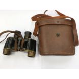 A pair of early 20th Century Hunsicker & Alexis of Paris military binoculars marked M.G. I.I.