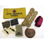 A quantity of insignia badges and buttons including Civil Defence Corps yellow armband,