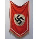 A German Nazi design flag, central black swastika upon a white circle, red ground and white border.