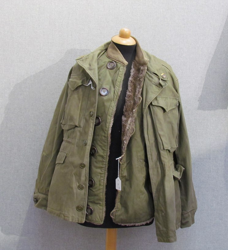 A WWII US M-43 jacket dated 1944 together with M-43 cold weather liner (2)