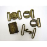 A quantity of military belt buckles including Dieu et Mon Droit Victorian brass example etc