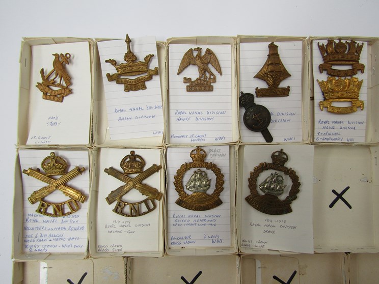 A collection of Naval cap badges including Royal Naval Division Machine Gun and Royal Naval