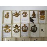 A collection of Naval cap badges including Royal Naval Division Machine Gun and Royal Naval