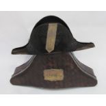 A 19th Century Naval cocked hat with scumbled tin case.
